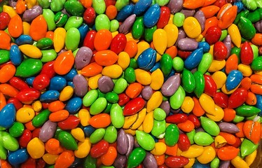 Closeup of the vibrant chocolate-covered sunflower seeds in a rainbow of colors.