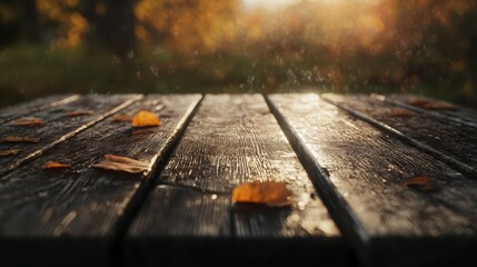 Close-up of Wooden Table with Autumn Leaves and Warm Light