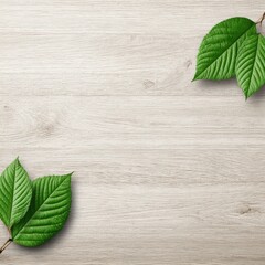 Two sets of vibrant green leaves arranged symmetrically on a light beige wood grain background, leaving ample space in the center