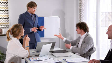 Business dialogue between two men in a conference room. Directors' meeting. A group of office...