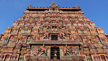 The closeup of a gateway tower full of colorful carvings at Nataraja Temple, Chidambaram, Tamil...