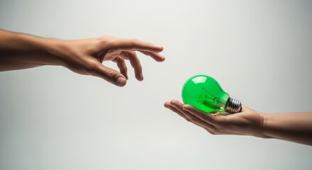 Giving the green light, hand giving a green light buld signifying they're ready or clear to go