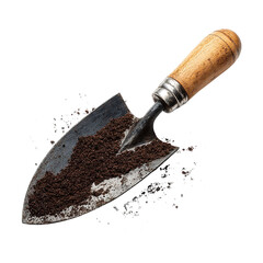 A small metal trowel filled with dark soil against a black background with scattered soil particles