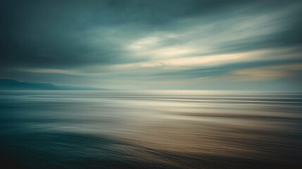 Obraz premium Tranquil Ocean Horizon Under a Serene and Moody Sky