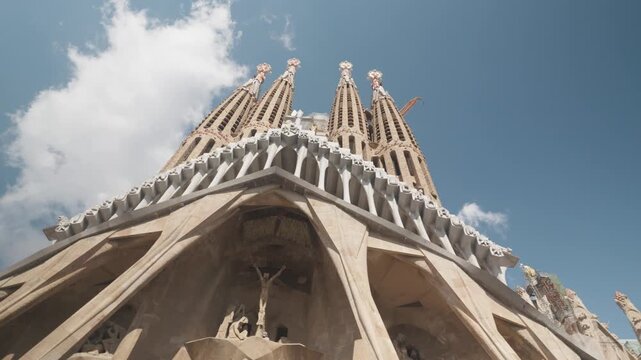 Experience the stunning design of a grand cathedral, showcasing intricate details against a beautiful sky. This architectural marvel stands tall, inviting admiration from all angles.