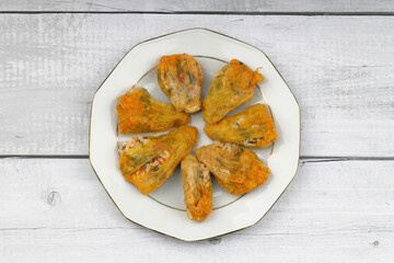 Pumpkin or Zucchini Flowers Dolma Stuffed with Rice Pilaf . Turkish Food in Plate. Traditional Organic Food.