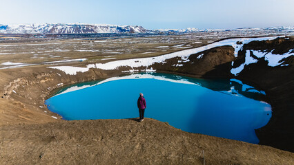 Vibrant blue waters and unique landscapes at Krafla crater in Iceland during clear weather