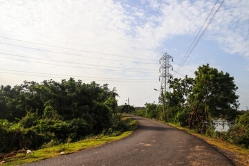 electricity pylon near road in the beautiful countryside of Chennai India 