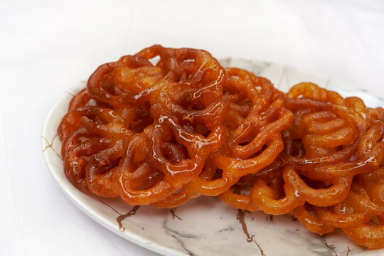 Indian traditional sweet Imarti also know as Amriti, Omriti, Jahangir, Jalebi, Jaangiri etc. It is made on the specials occasion Ratha yatra. Indian sweets concept. Selective focus.
