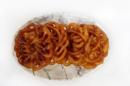 Indian traditional sweet Imarti also know as Amriti, Omriti, Jahangir, Jalebi, Jaangiri etc. It is made on the specials occasion Ratha yatra. Indian sweets concept. Selective focus.