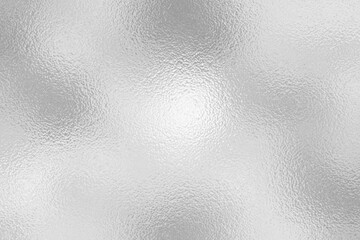 gray foil glass texture background. Abstract gradient bright light reflection and shiny rough texture surface. The light softly scatters, creating a shimmering effect with varying tones of silver gray