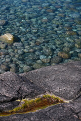 Blue sea and stones, for backgrounds or textures