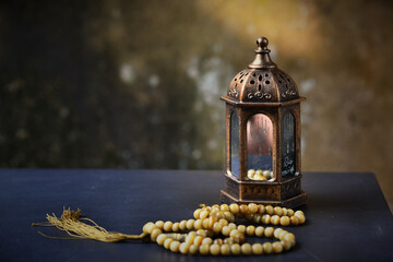 Islamic lanterns isolated on a dark background, the concept of Ramadan, Eid al-Fitr, and other Islamic holidays. Stunning Ramadan candle lanterns with free space