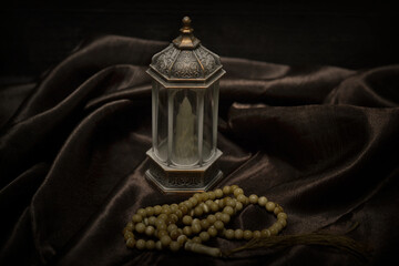 Islamic lanterns isolated on a dark background, the concept of Ramadan, Eid al-Fitr, and other Islamic holidays. Stunning Ramadan candle lanterns with free space