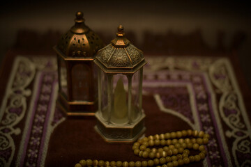 Islamic lanterns isolated on a dark background, the concept of Ramadan, Eid al-Fitr, and other Islamic holidays. Stunning Ramadan candle lanterns with free space