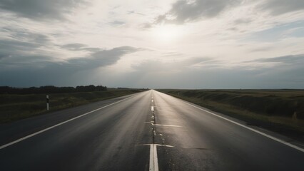 Straight Highway Stretching into the Horizon Under a Cloudy Sky