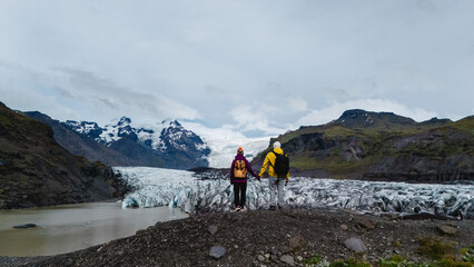 Explore the breathtaking Svinafellsjokull Glacier in Iceland with adventure seekers at its edge