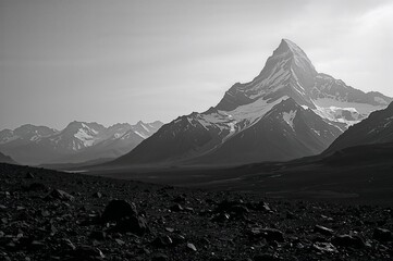 Dramatic black and white landscape of a jagged mountain peak