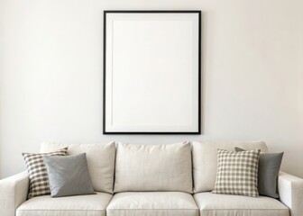 frame mockup. A modern living room featuring a light sofa adorned with decorative pillows and a blank frame on the wall, promoting a minimalist aesthetic.