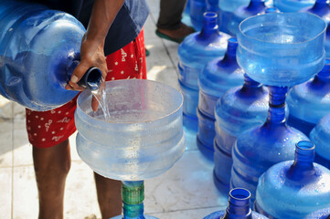 transferring drinking water from drinking water gallons
