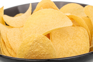 Crispy potato chips isolated on white background, close-up.