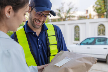Delivery express courier young man use giving boxes or Food to woman customer  at front home