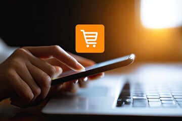 Hands on smartphone, shopping cart icon, laptop