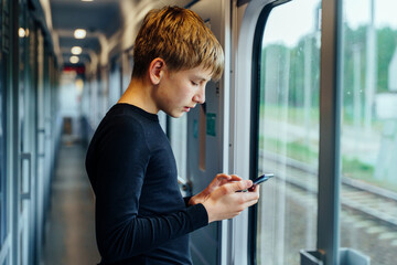 Using smartphone in train corridor
