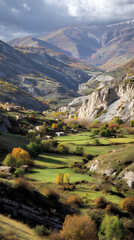 Panoramic View of Autumn Colors in Lush Open Field Surrounded by Rugged Mountains and Dynamic Sky