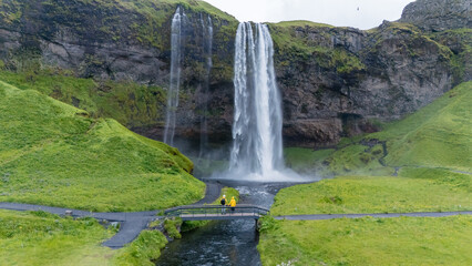 Explore the breathtaking Seljalandsfoss waterfall surrounded by lush Icelandic landscapes