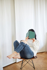 A Korean woman resting at home on holidays.
