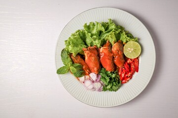 Mackerel in tomaro sauce ,Spicy Canned Mackerel salad, canned fish,Tinned fish in a white plate