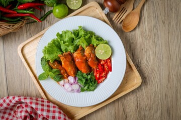 Mackerel in tomaro sauce ,Spicy Canned Mackerel salad, canned fish,Tinned fish in a white plate