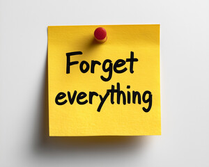 Yellow sticky note with 'Forget everything' message