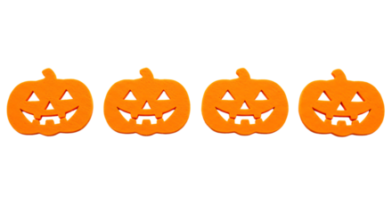 Four orange jackolanterns with carved faces isolated on transparent background