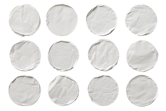 A grid of twelve crumpled, white circles