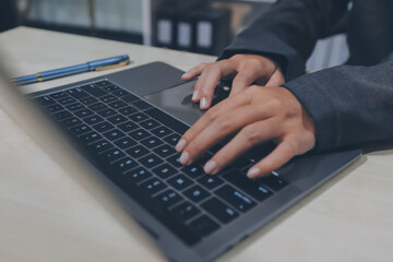 Entrepreneur Asian businessman and businesswoman discussing new business project in tablet in...