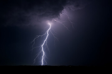 Massive lightning bolt with branches isolated on black background. 3d render
