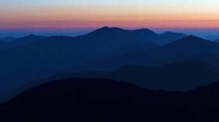 Obraz premium Twilight valley landscape with mountains painted in deep blue and fading sunset tones.