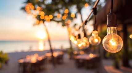 Golden evening light reflecting on outdoor dining tables with soft string light bokeh