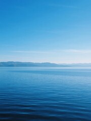 Obraz premium Calm Blue Waters Under a Clear Sky