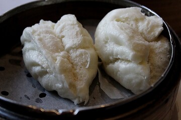 Traditional Chinese Steamed Buns  in Bamboo Steamer – Dim Sum Classic