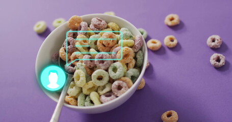 White bowl holding rings, sitting on purple tabletop, with silver spoon and turquoise UI overlay