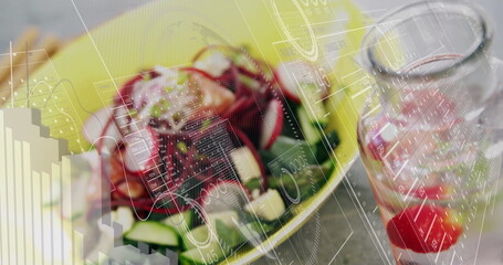 Displaying vibrant salad with cucumber slices in bowl on wooden table beside jar with data overlays