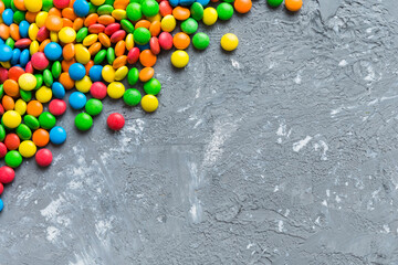 Mixed collection of colorful candy, on colored background. Flat lay, top view. frame of colorful...