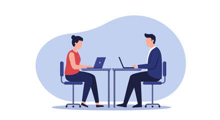 Two people working at desks on laptops in a modern office setting