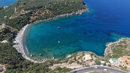 Obraz premium Aerial View of Secluded Beach Cove with Turquoise Waters in Mani Peninsula, Peloponnese, Greece, Delfinia beach