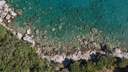 Aerial View of Secluded Beach Cove with Turquoise Waters in Mani Peninsula, Peloponnese, Greece, Delfinia beach