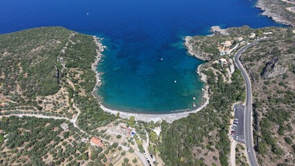 Obraz premium Aerial View of Secluded Beach Cove with Turquoise Waters in Mani Peninsula, Peloponnese, Greece, Delfinia beach