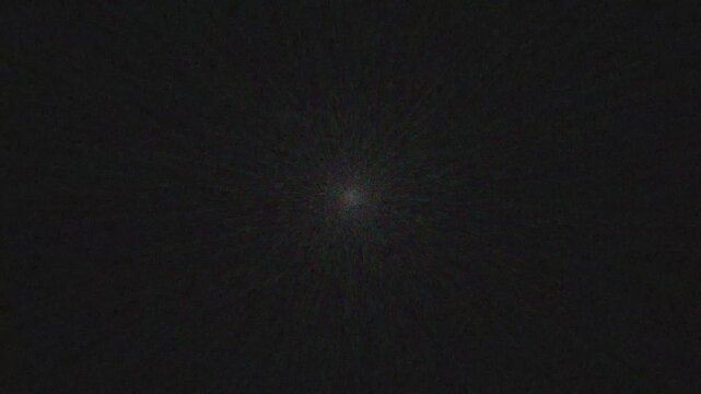 White light at the top on a blue background. Animations of the Sun's rays, Beautiful 4K white spotlight effects, moving. Flashes, bright light, twinkling star effect.Top center sun rays  